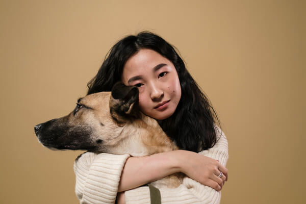 Chinese lady holding her dog